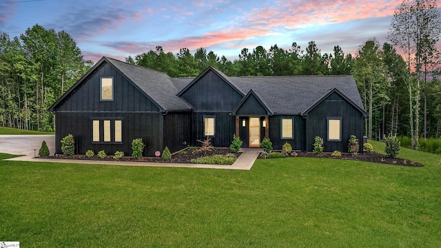 modern farmhouse featuring a lawn