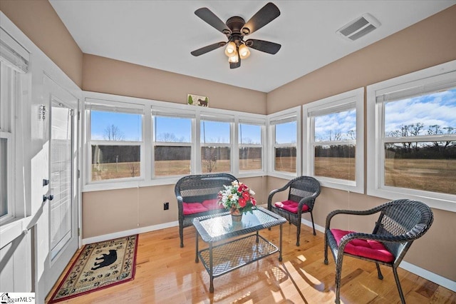 sunroom / solarium with ceiling fan