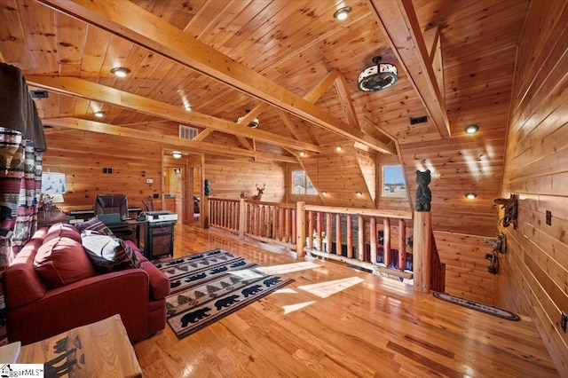 interior space with lofted ceiling with beams, wooden walls, wood ceiling, and wood-type flooring