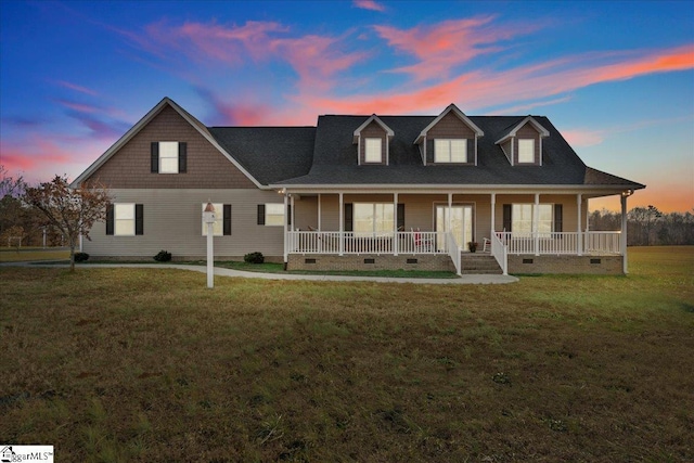 view of front facade with a yard and a porch