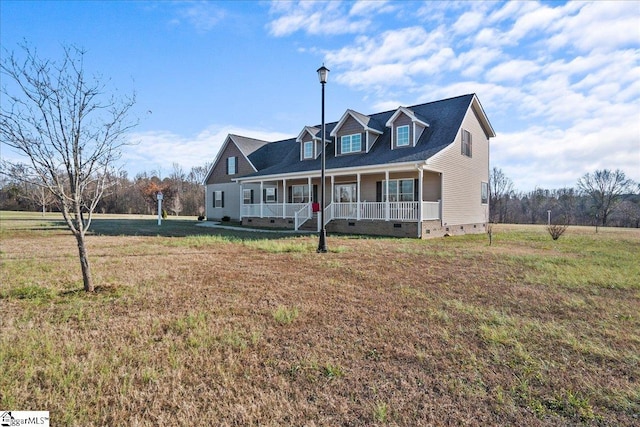 cape cod-style house with a front yard and a porch