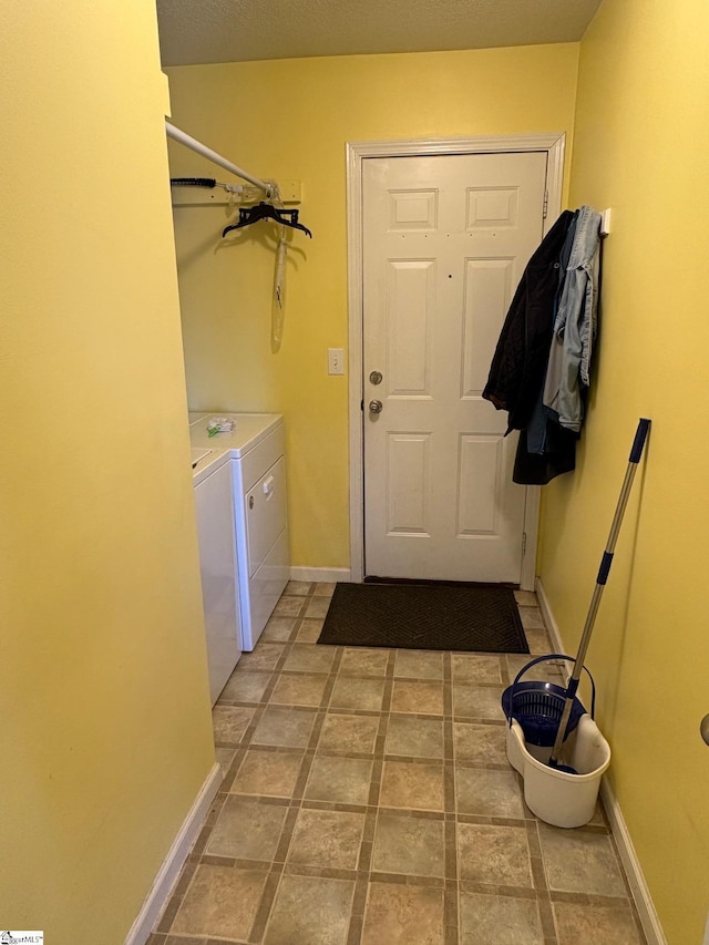 washroom featuring washer and clothes dryer