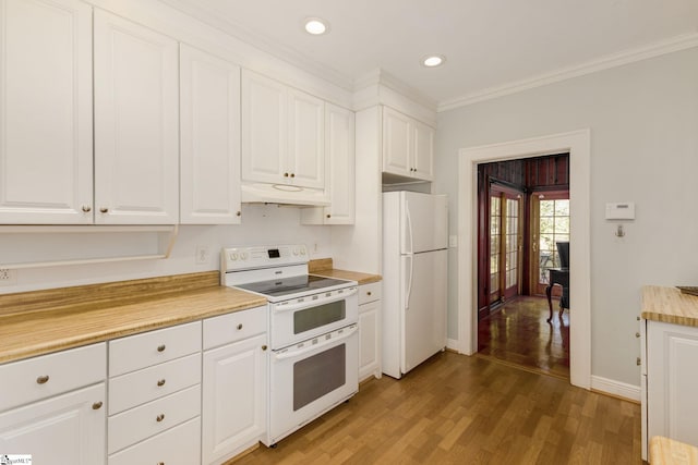 kitchen featuring white cabinetry and white appliances