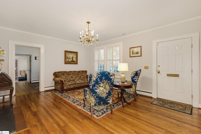 living room featuring a chandelier, wood-type flooring, baseboard heating, and crown molding