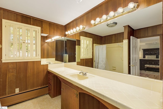 bathroom featuring wood walls, vanity, and a shower with shower curtain