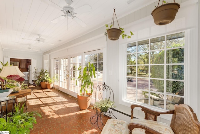 sunroom / solarium with ceiling fan and wooden ceiling