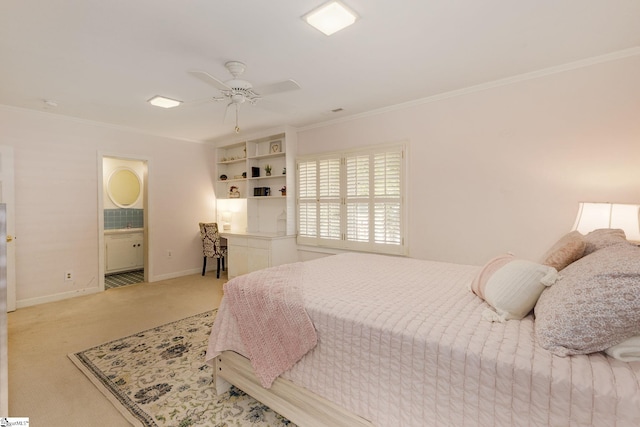 bedroom with carpet flooring, ensuite bath, ceiling fan, and ornamental molding