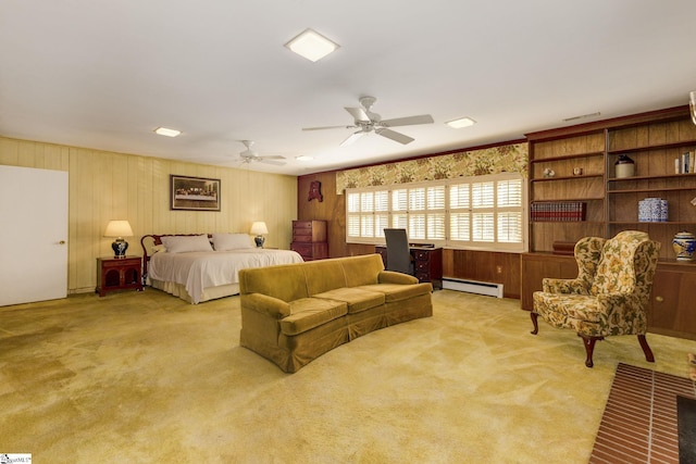 bedroom featuring ceiling fan, light colored carpet, and a baseboard radiator