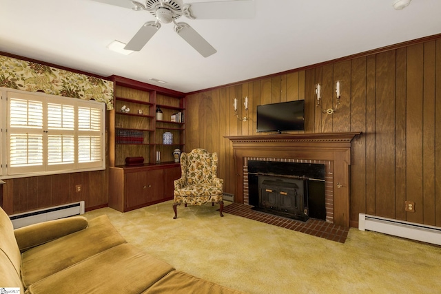 carpeted living room featuring a brick fireplace, wooden walls, and a baseboard heating unit