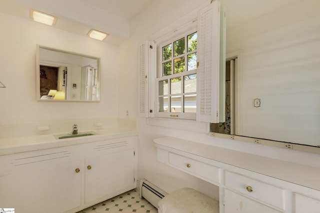 bathroom with vanity and a baseboard radiator