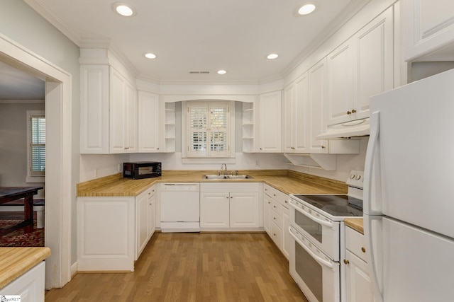 kitchen with white cabinetry, sink, white appliances, and light hardwood / wood-style flooring