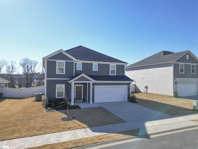 front of property featuring a garage and central air condition unit