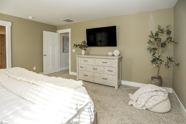 bedroom featuring light carpet