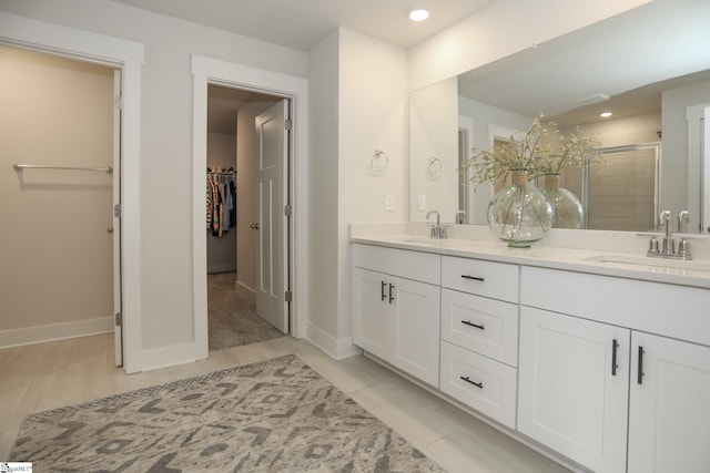 bathroom with vanity and an enclosed shower