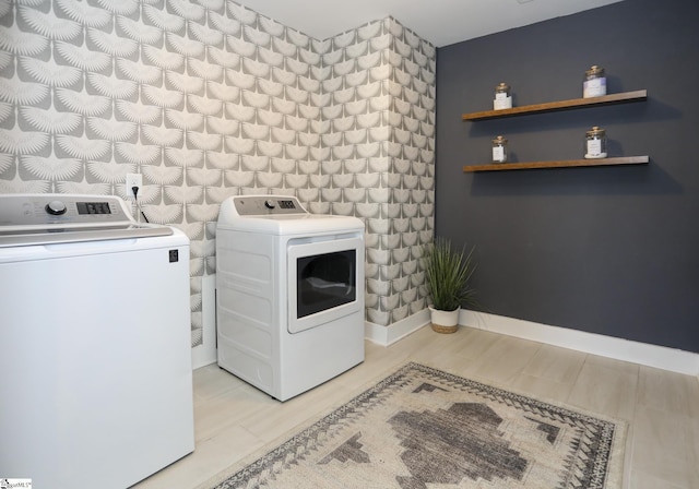 clothes washing area featuring washing machine and clothes dryer