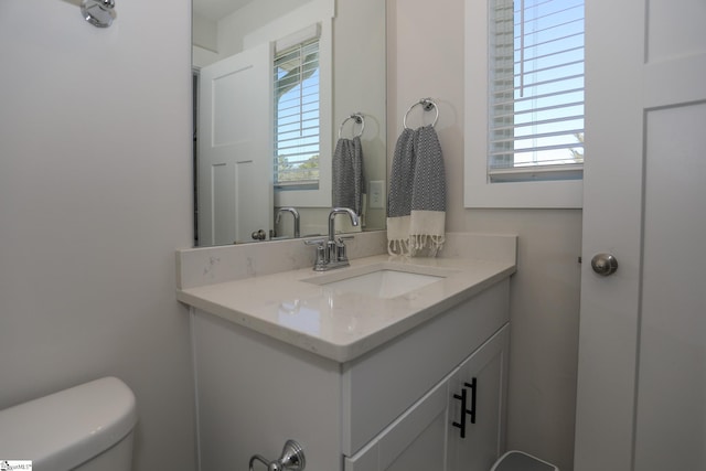 bathroom with vanity and toilet