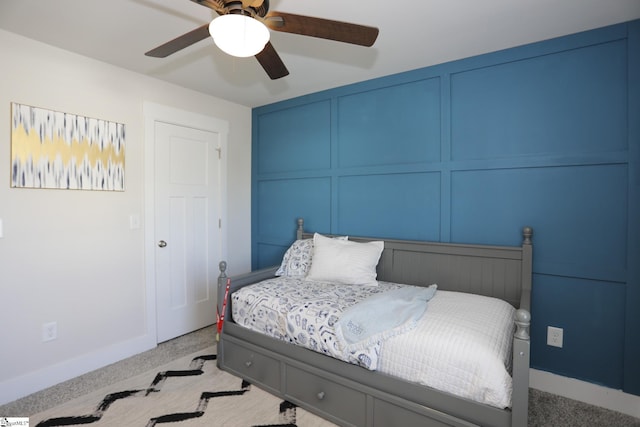 carpeted bedroom with ceiling fan