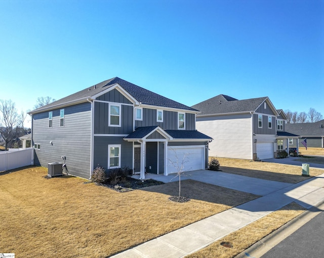 front of property with a garage and cooling unit