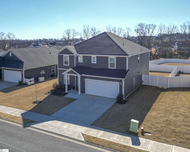 view of front facade with a front yard and a garage