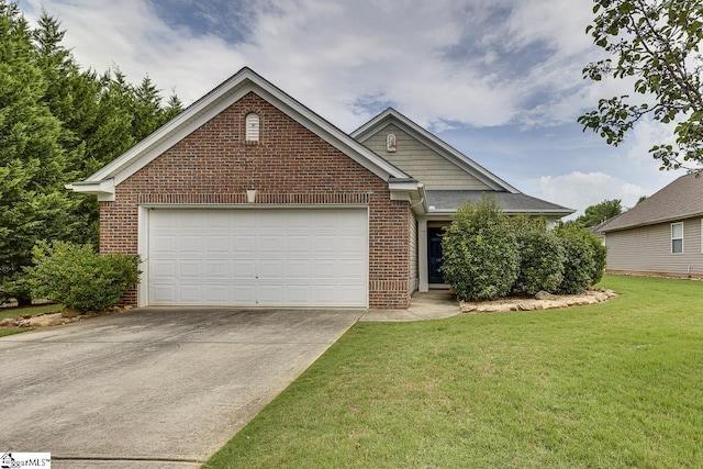 view of front of home with a garage and a front lawn