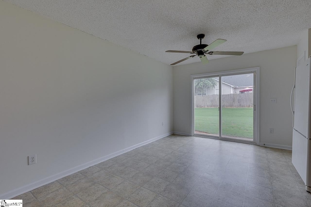 spare room with ceiling fan and a textured ceiling