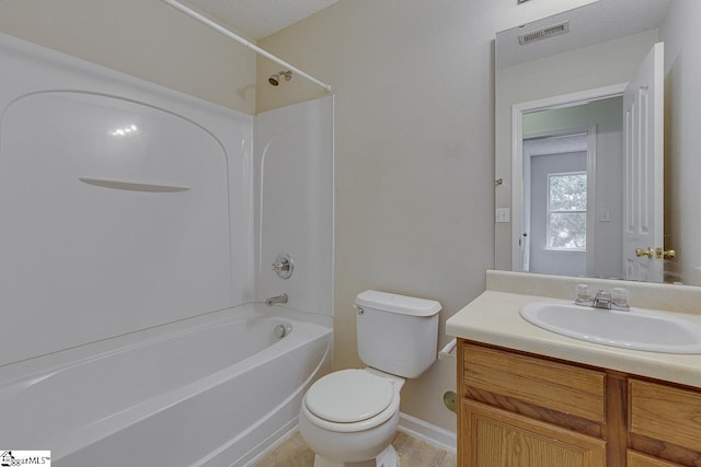 full bathroom featuring vanity, tub / shower combination, a textured ceiling, and toilet