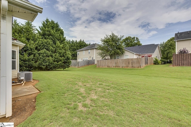 view of yard with central AC