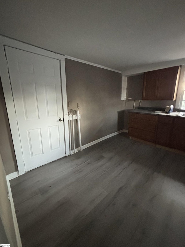 kitchen featuring crown molding and sink