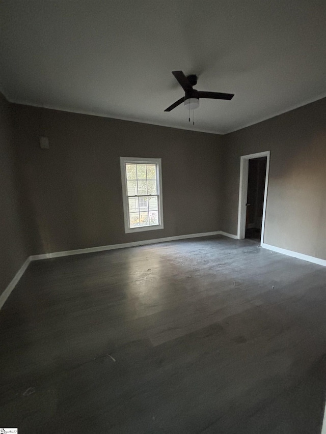 unfurnished room with ceiling fan and hardwood / wood-style flooring