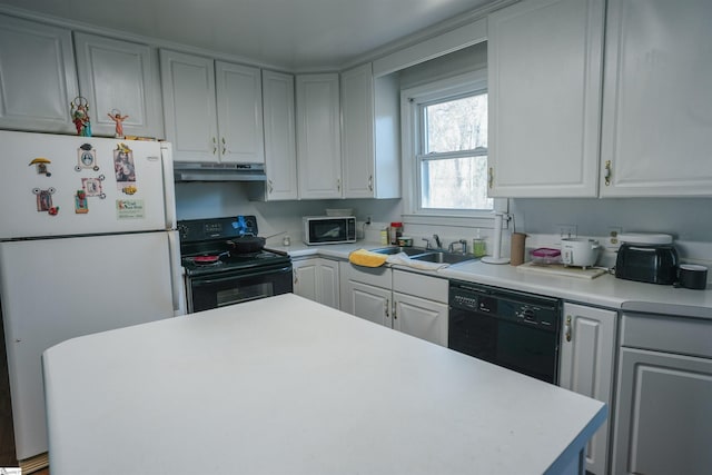 kitchen with sink, white cabinetry, and black appliances