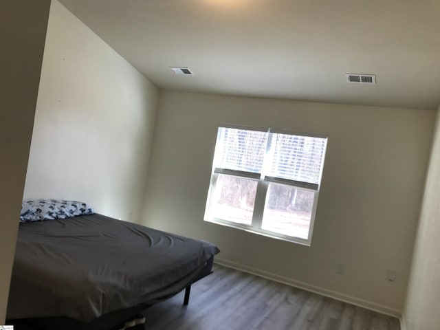 bedroom with light hardwood / wood-style flooring