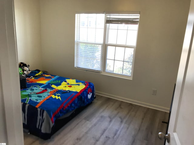 bedroom featuring hardwood / wood-style floors