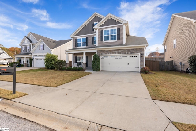 view of front of house with a front yard and a garage