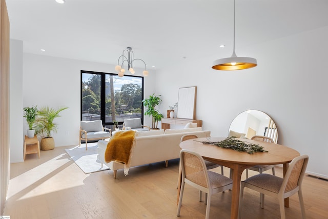 bedroom featuring a chandelier and light hardwood / wood-style floors