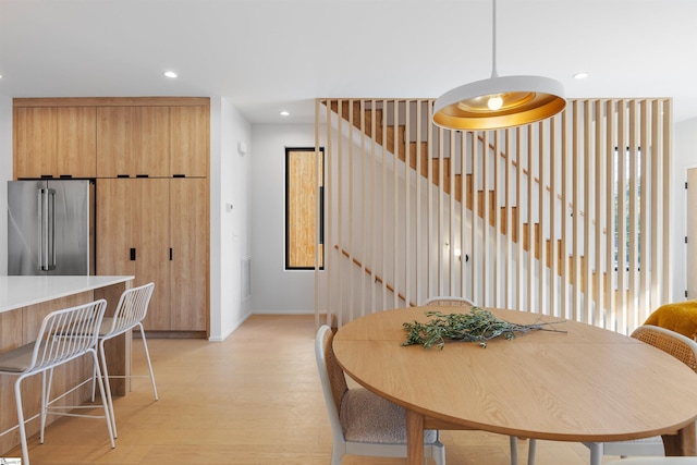 dining area with light hardwood / wood-style flooring