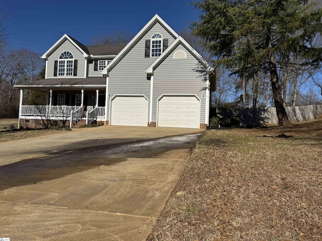 view of front of home featuring a porch and a garage