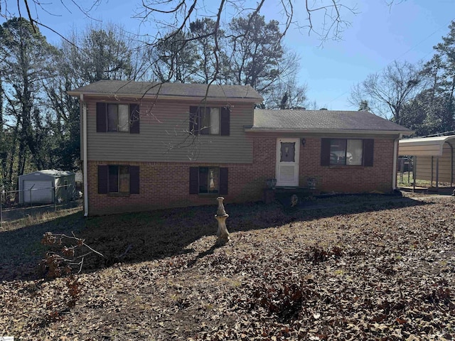 rear view of house featuring a carport