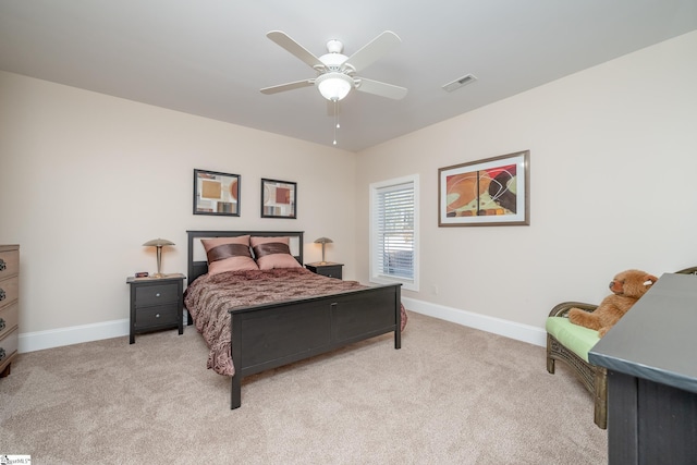 bedroom featuring ceiling fan and light carpet