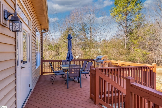 wooden deck with area for grilling