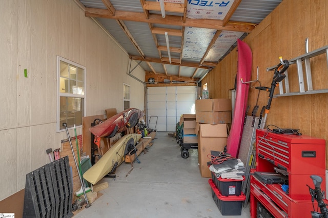 garage featuring wooden walls