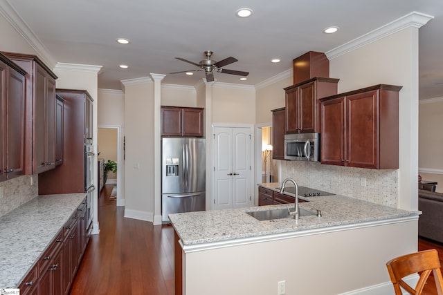 kitchen with backsplash, light stone countertops, ornamental molding, and appliances with stainless steel finishes