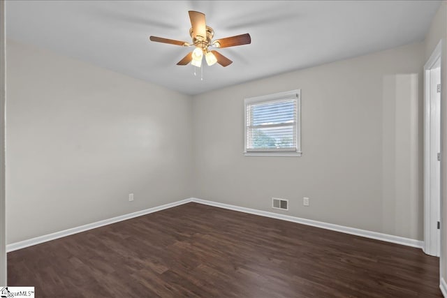 unfurnished room with ceiling fan and dark wood-type flooring