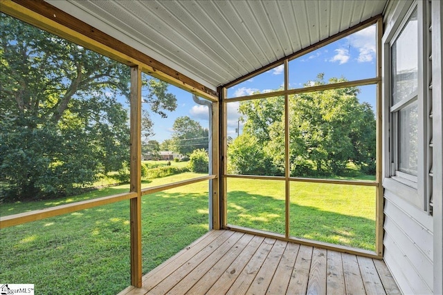 unfurnished sunroom with lofted ceiling