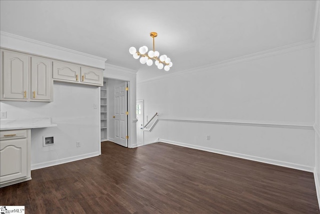 interior space featuring dark hardwood / wood-style flooring, pendant lighting, a notable chandelier, and ornamental molding