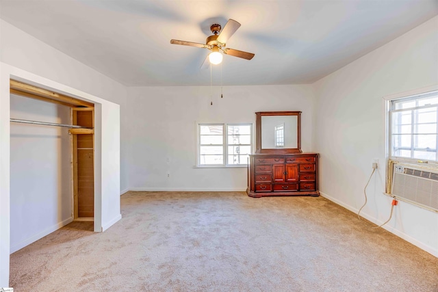 unfurnished bedroom with ceiling fan, a closet, and light carpet