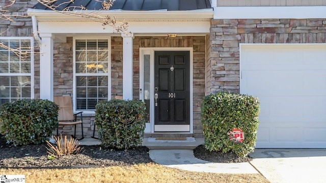 doorway to property featuring a garage