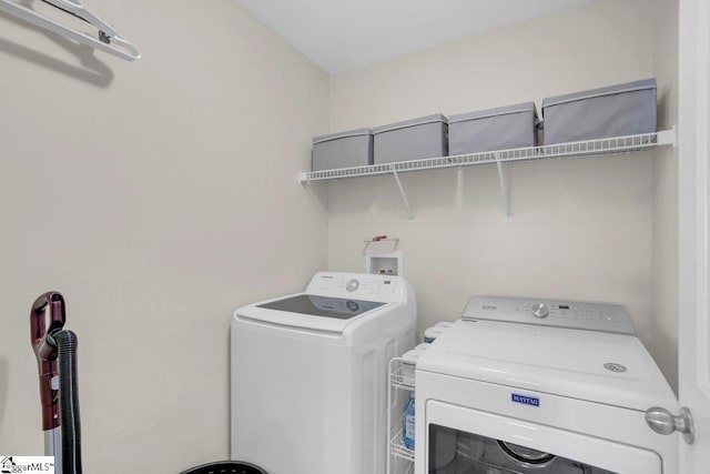 laundry area with washer and clothes dryer