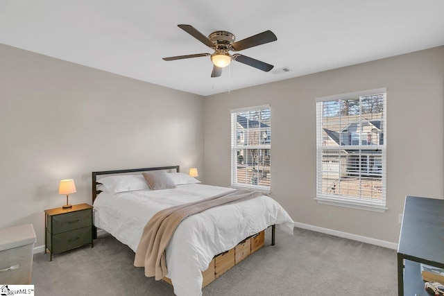 bedroom featuring light carpet and ceiling fan