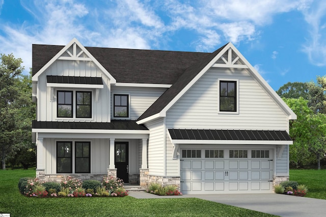 view of front of home featuring a front yard and a garage