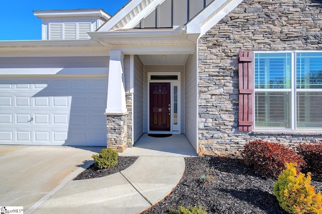 view of exterior entry with a garage